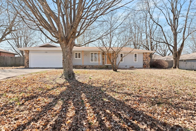 ranch-style home with fence, a garage, driveway, and crawl space