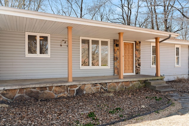 doorway to property with a porch