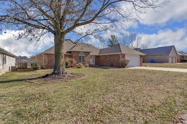 view of front of home with central air condition unit, driveway, a front lawn, an attached garage, and brick siding