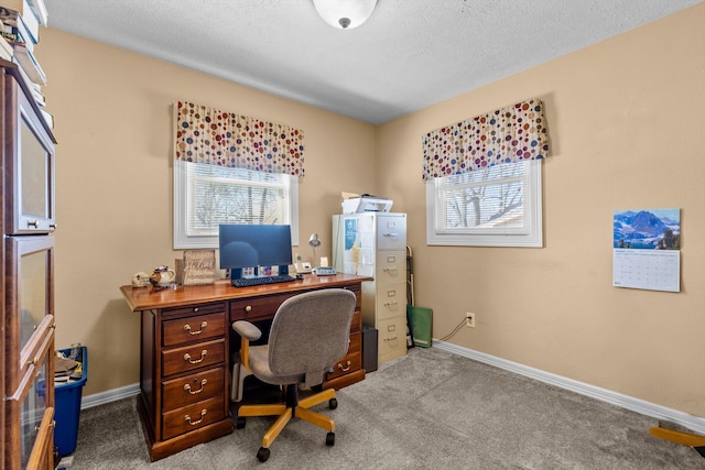 office area with a wealth of natural light, carpet flooring, and baseboards