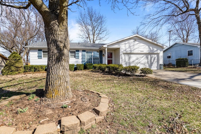 ranch-style house featuring driveway and an attached garage