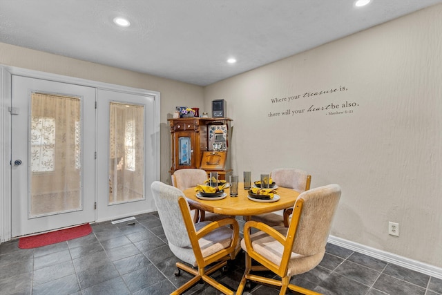 dining space featuring recessed lighting and baseboards