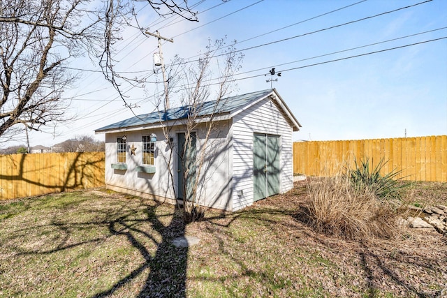 view of outbuilding featuring an outbuilding and a fenced backyard