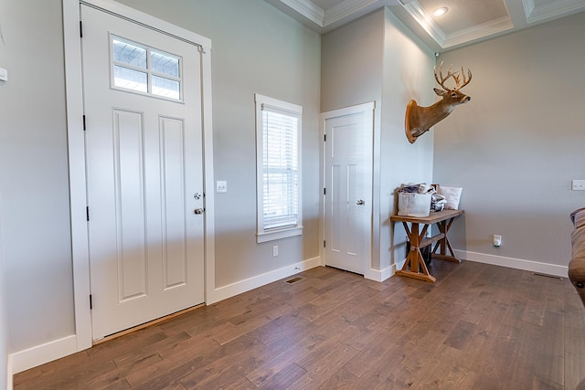 foyer entrance with wood finished floors, plenty of natural light, and ornamental molding