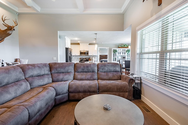 living area with visible vents, crown molding, baseboards, beam ceiling, and dark wood-style floors