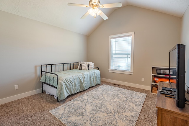 carpeted bedroom featuring lofted ceiling, visible vents, baseboards, and ceiling fan