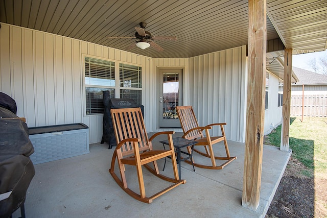 view of patio / terrace with a ceiling fan and fence