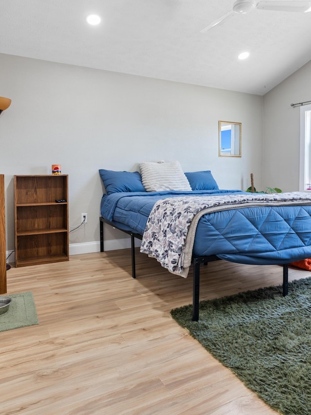 bedroom featuring recessed lighting, wood finished floors, and baseboards