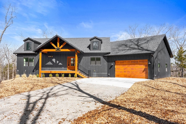 modern farmhouse style home featuring an attached garage, roof with shingles, and driveway