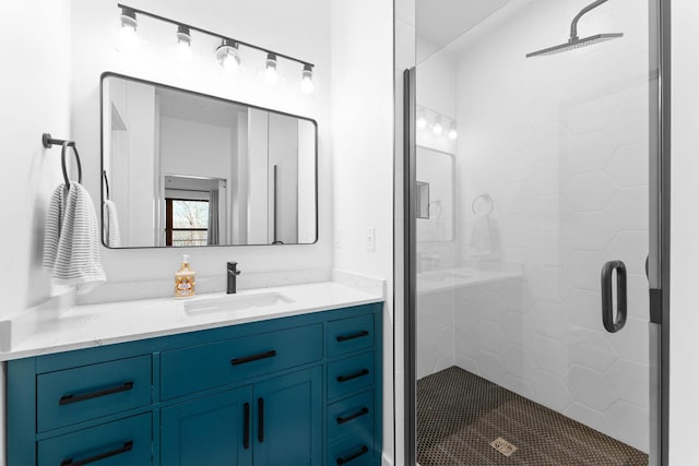 bathroom with a stall shower and vanity