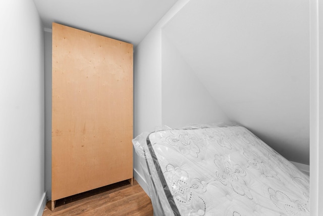 bedroom featuring wood finished floors