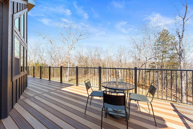 deck with outdoor dining area