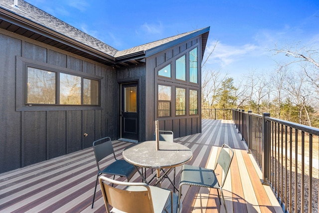 wooden terrace featuring outdoor dining area