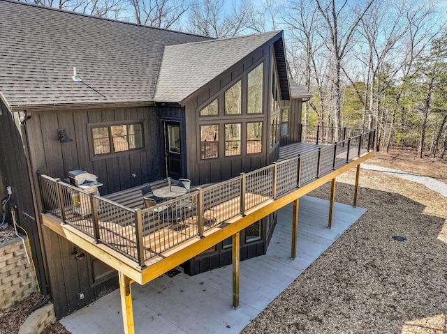 wooden deck with a patio area