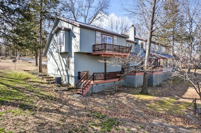 25906 Farm Rd Unit 1263, Golden, MO 65658 - back of house with central AC unit, a chimney, and a deck