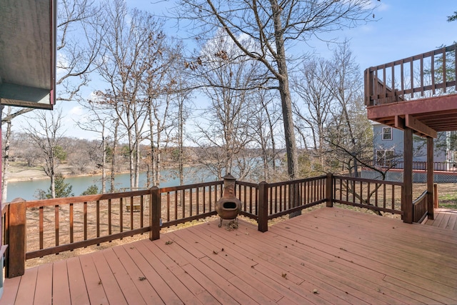 wooden deck with a water view