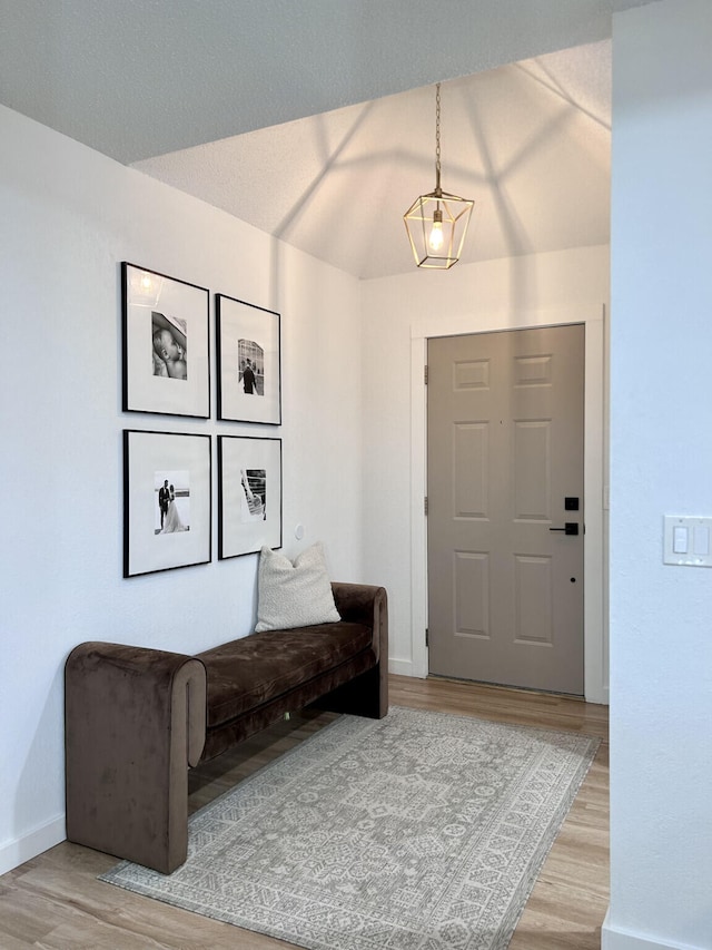 foyer entrance featuring light wood-type flooring and baseboards