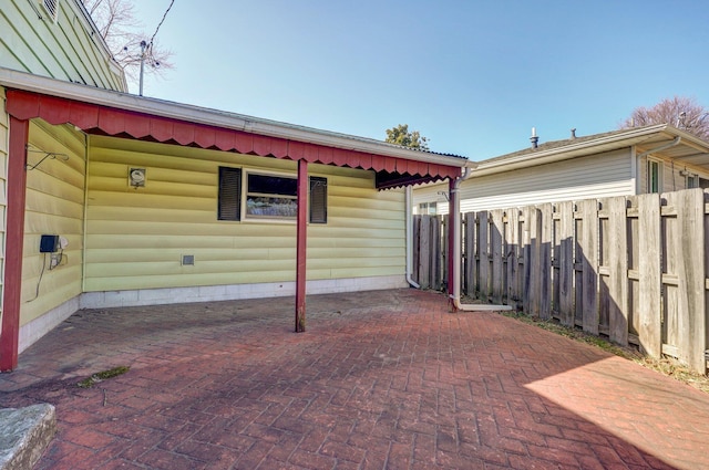 view of patio featuring fence