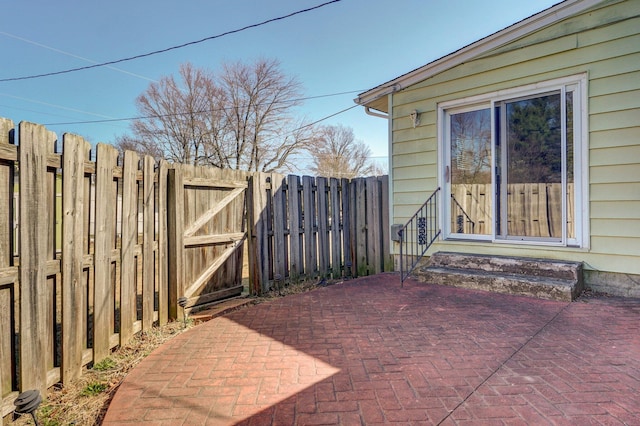 view of patio / terrace with a gate and fence