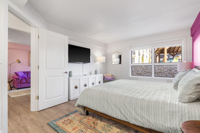 bedroom featuring wood finished floors