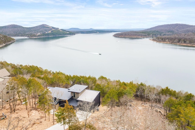 bird's eye view with a water and mountain view