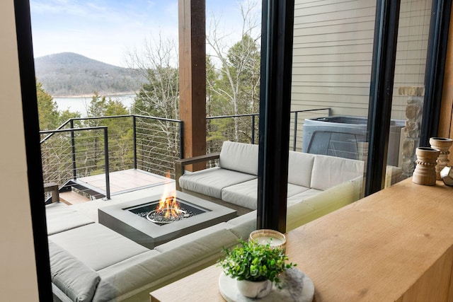 balcony with a mountain view and a fire pit