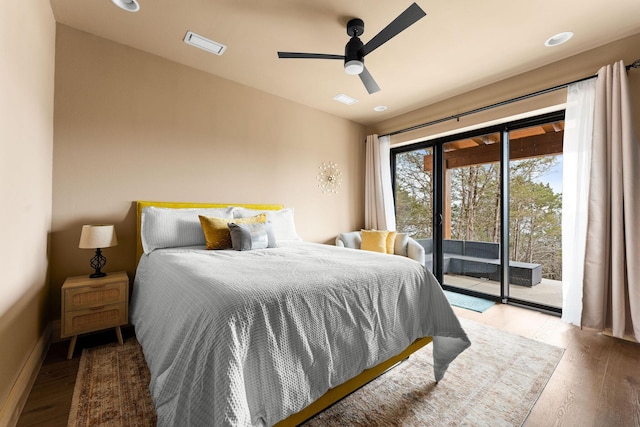 bedroom featuring baseboards, wood finished floors, access to exterior, and a ceiling fan