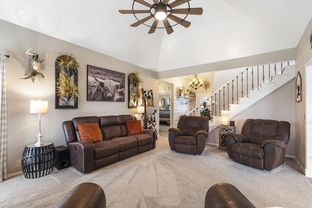 living room with carpet floors, high vaulted ceiling, stairs, and ceiling fan with notable chandelier