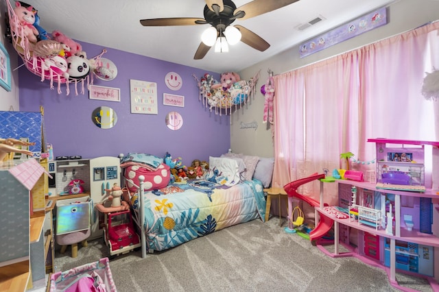 bedroom featuring visible vents, carpet flooring, and a ceiling fan