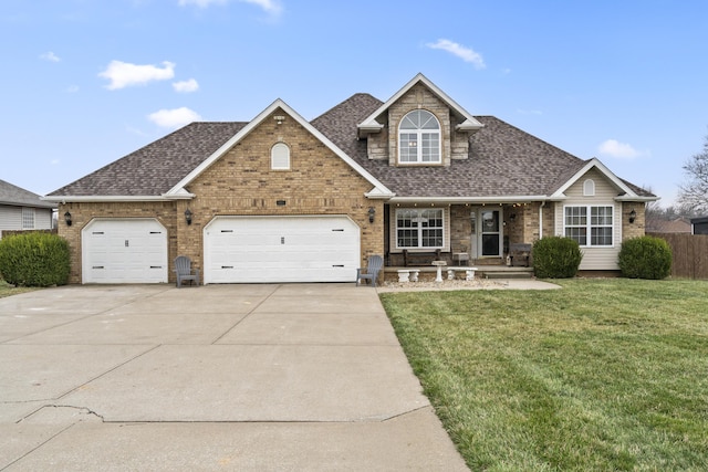 view of front of home featuring a garage, brick siding, concrete driveway, and a front lawn