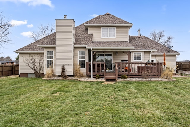 back of property featuring a yard, a shingled roof, a chimney, and fence