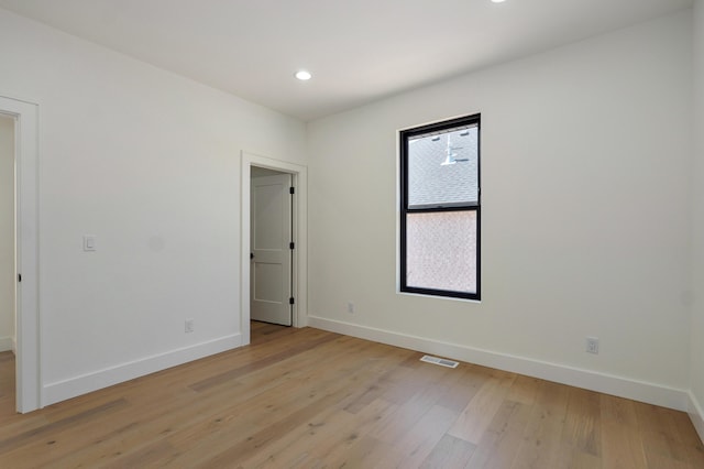 empty room featuring recessed lighting, visible vents, baseboards, and light wood-style floors