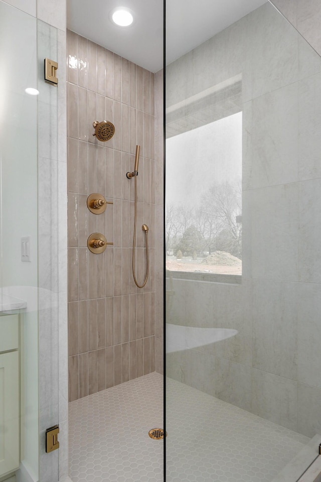 bathroom with a tile shower