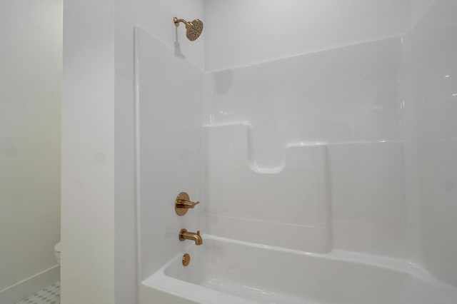 full bathroom featuring toilet and washtub / shower combination