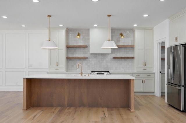 kitchen with decorative backsplash, open shelves, light countertops, and stainless steel refrigerator with ice dispenser