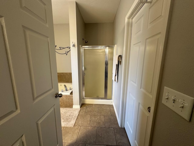 bathroom featuring a garden tub and a stall shower