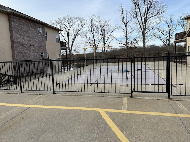 view of gate with fence