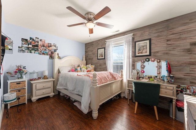 bedroom with visible vents, a ceiling fan, and dark wood-style flooring