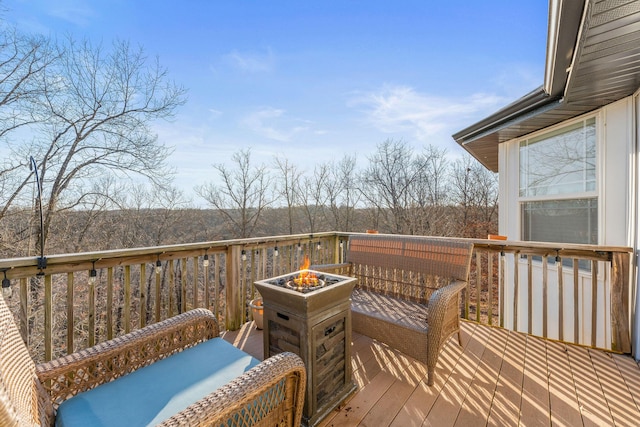 wooden deck featuring a fire pit