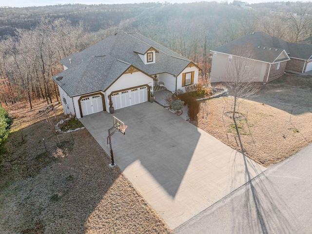 drone / aerial view featuring a view of trees