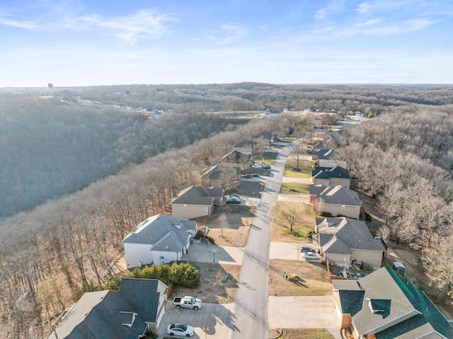 drone / aerial view featuring a forest view