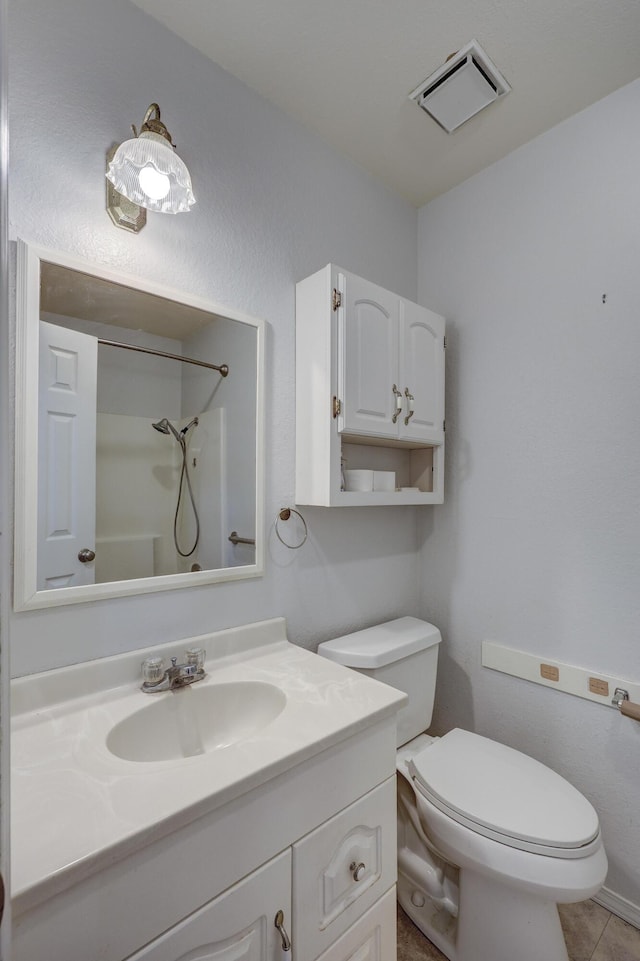 full bathroom featuring vanity, visible vents, tile patterned flooring, a shower, and toilet