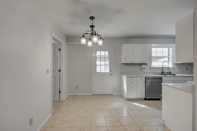 kitchen with dishwasher, light countertops, a wealth of natural light, white cabinets, and a sink