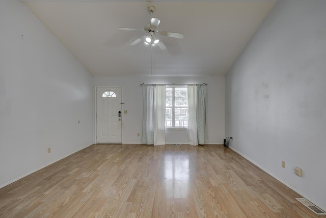 entryway featuring lofted ceiling, visible vents, light wood finished floors, and ceiling fan