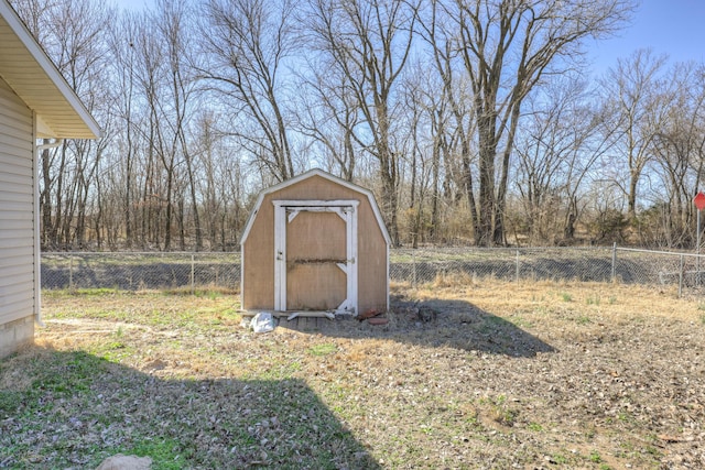 view of shed with fence