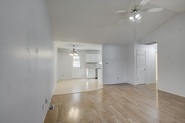 unfurnished living room with visible vents, light wood-style floors, vaulted ceiling, and ceiling fan with notable chandelier