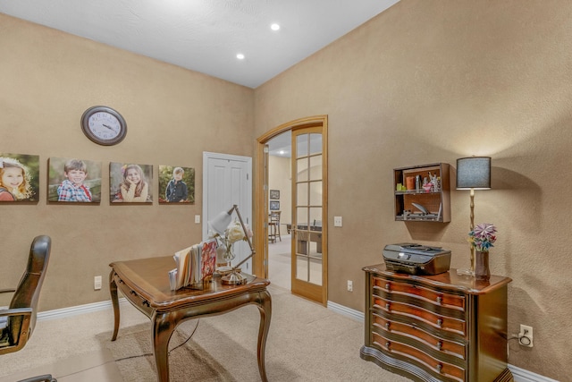 office space with recessed lighting, french doors, baseboards, and light carpet