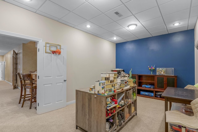 recreation room featuring light carpet, visible vents, recessed lighting, and a drop ceiling