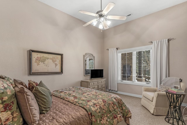 carpeted bedroom featuring a ceiling fan, baseboards, and visible vents