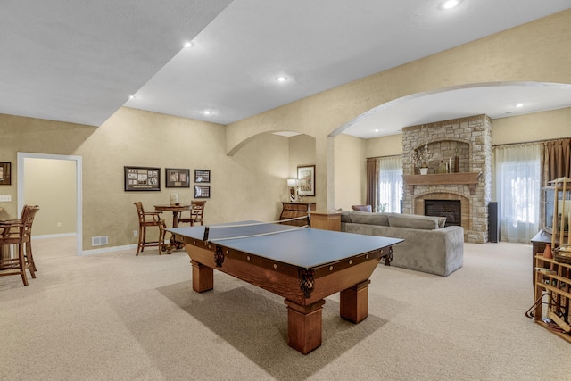 recreation room with recessed lighting, a fireplace, baseboards, and carpet